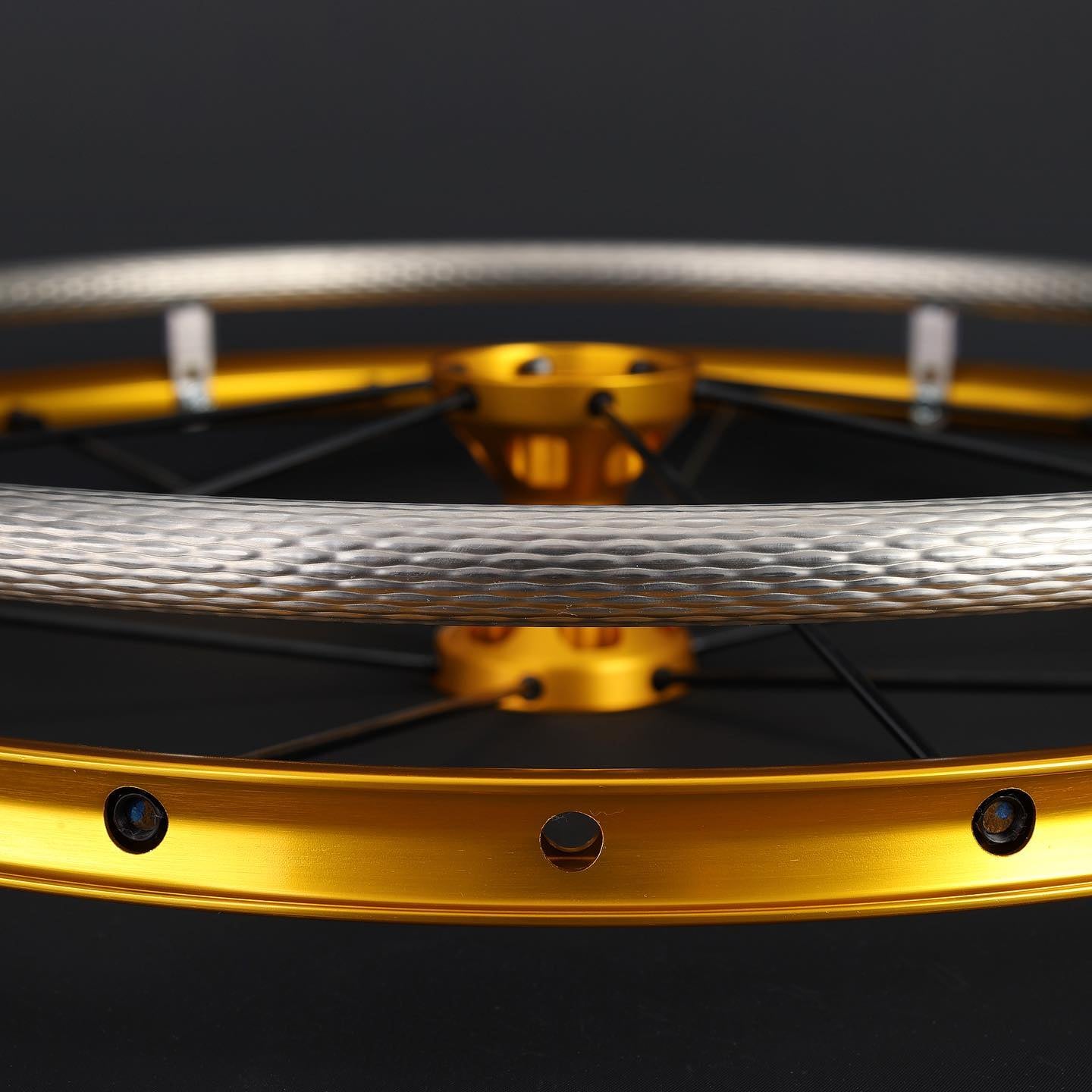 Close up of gold spinergy wheel with tc max handrim