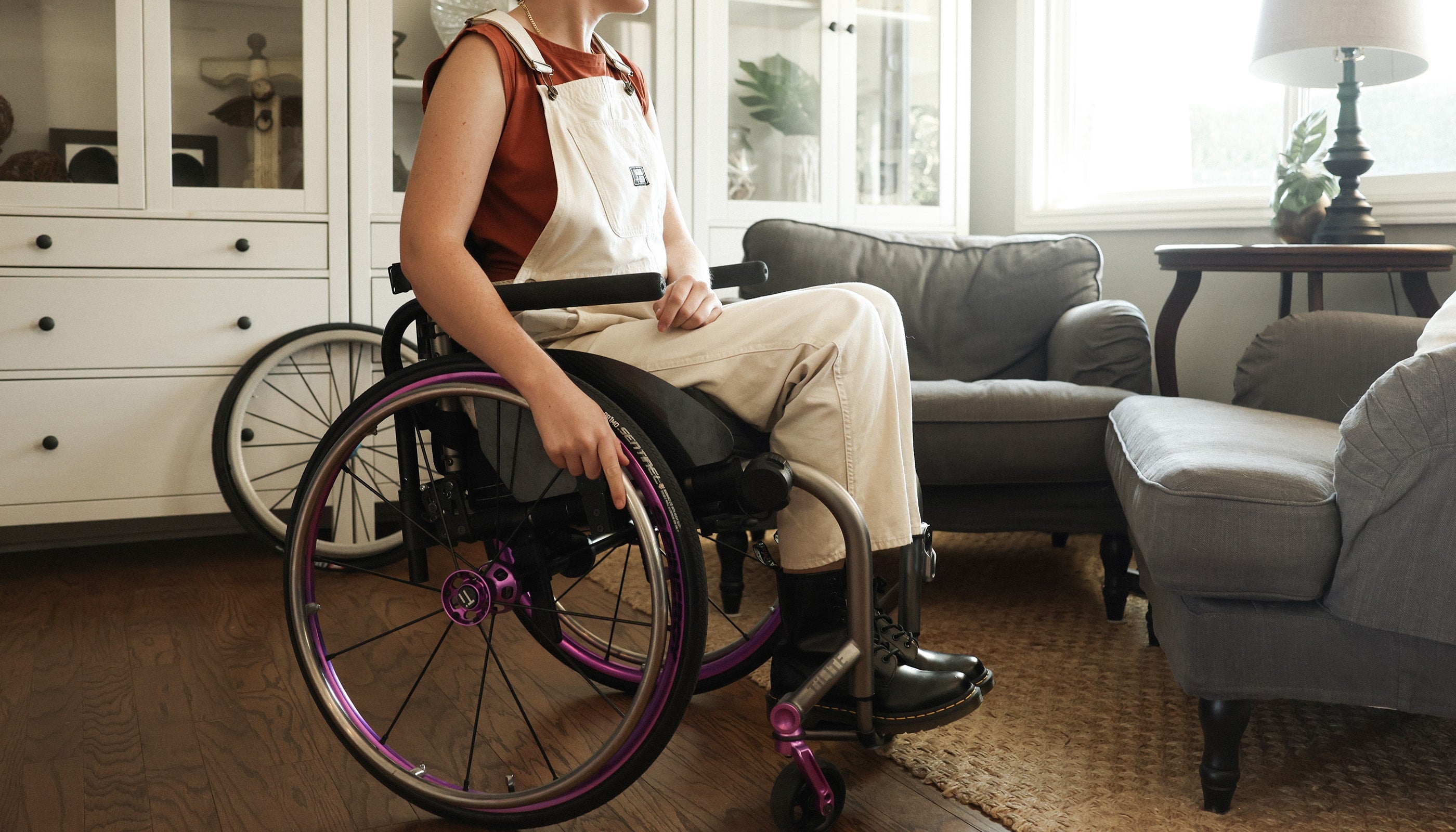 Claire Raymond with spinergy wheels in her living room